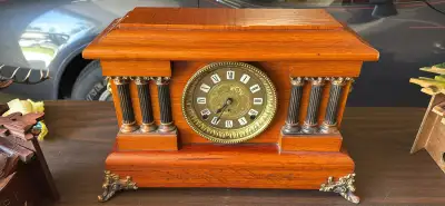 Late 19th century Seth Thomas mantel clock featuring an Adamantine finished case, faux marble column...