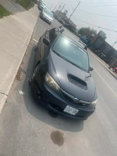 This is a used 2009 Subaru Impreza WRX sedan with a powerful engine and sporty performance. I am sel...