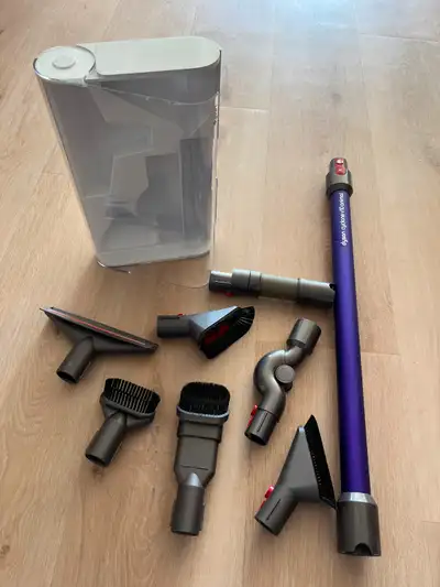 Selling various cleaning tools used for a Dyson cyclone V10 animal vaccum, along with a storage case...