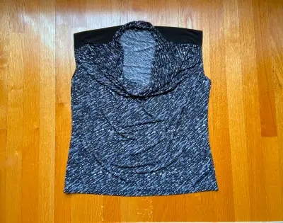 Women's size XL top. In excellent condition. Smoke-free, pet-free home.