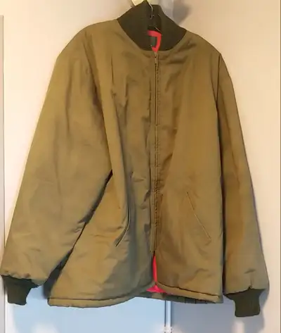 1970 Oshkosh bomber jacket. Military green. Size medium. Red liner has a small rip as seen in the pi...