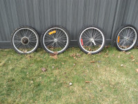 2 sets of Bike Wheels - perfect for bike trailer. Calls Only