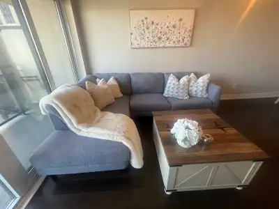 This stylish blue sectional couch from Structube offers comfortable seating and a modern design, per...