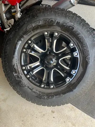 5 Toyo country AT2 with alloy rims. Size P285/70R17. Were on a 2018 jeep JKU. 5/16” tread, only used...