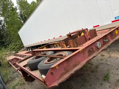 Older flat deck for moving mobile homes Located in red lake ontario