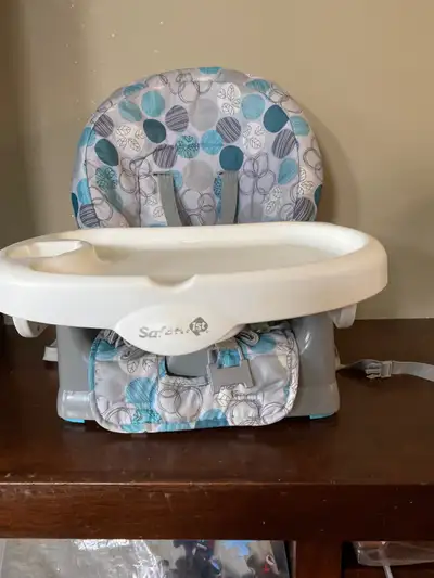 Booster seat for chairs. Straps to attach to chair. Cover is washable. Can easily be used without tr...