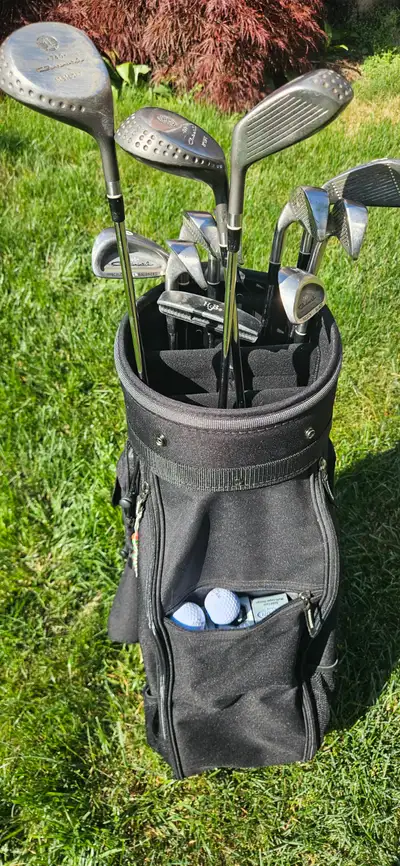 A set of 12 Golf Clubs lightly used, and NEW Wilson Bag.