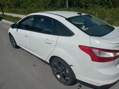 Check out this 2014 Ford Focus, a reliable and efficient sedan ready for your daily commute or weeke...