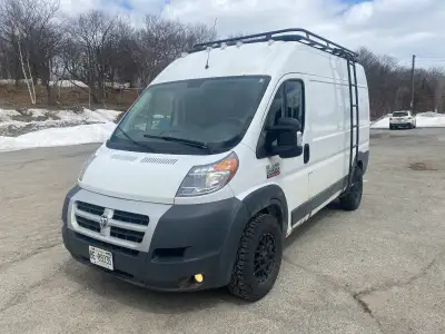 This is a Ram adventure van/work van equipped with a roof rack and ladder, ready for your next adven...