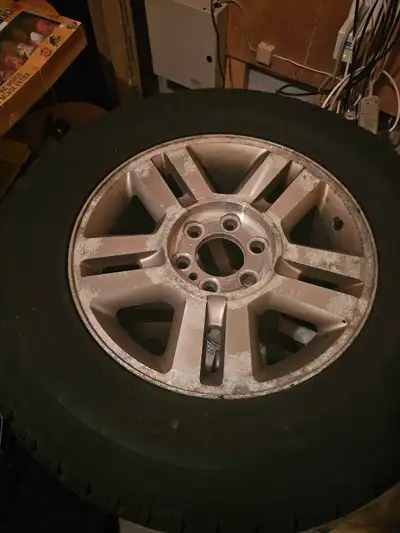 16 inch Ford rims with winter tires rims do not have cemter caps. tires have lots of tread left, mov...
