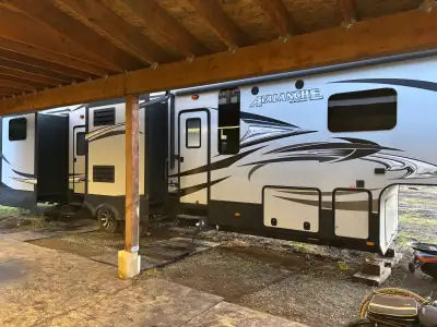 2015 keystone avalanch. 43’ long, two bed 1.5 bath, washer/dryer included.