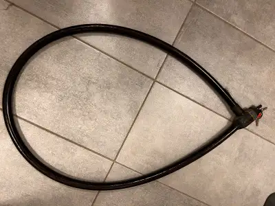 Braided steel cable. Dual sliding cylinder guards. 2 Keys. Approx 7’ in length and 1.5” thick