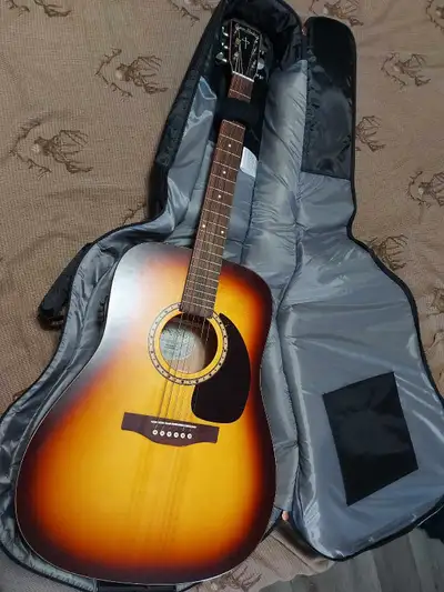 Beautiful Simon & Patrick electric acoustic guitar in perfect condition. Guitar comes with a soft ca...