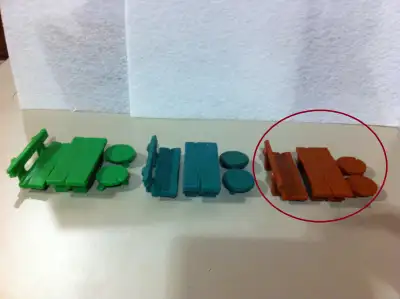 This ads shows 3 variants of Bench, Stool and Table Smurf playset and is offering one circled in RED...