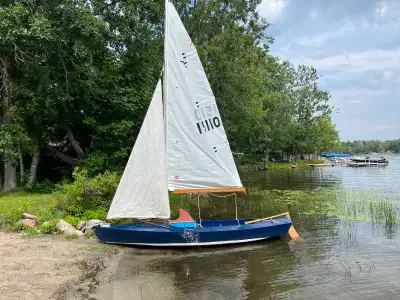 I'm selling a charming, used wooden sailboat that's ready for a new adventure! This sailboat feature...