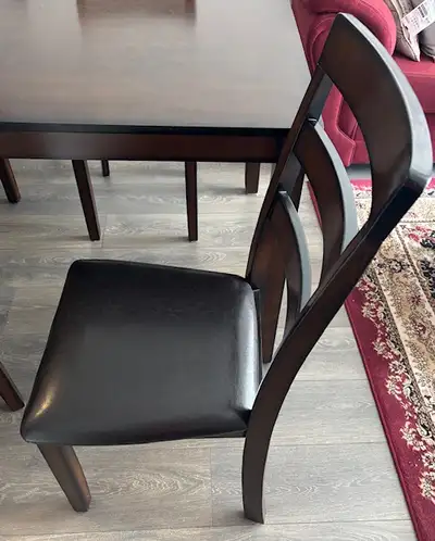 Dining table 60" x 36" with 4 chairs with leather seats from Ashley Furniture for sale. In mint cond...