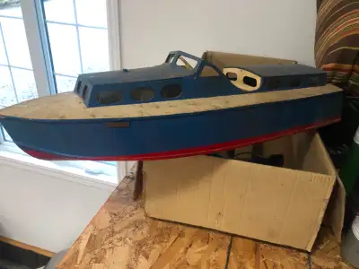 This is a vintage radio controlled model boat . It was built by my Dad and eldest brother many years...