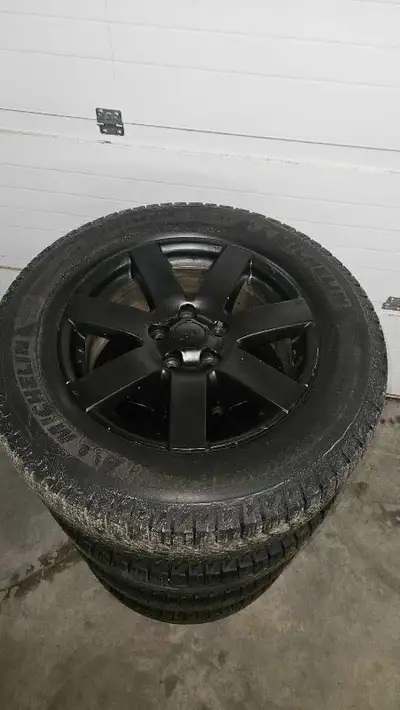 18in Jeep rims with P265/60R18 Michelin X Ice Latitude snow tires. 5x5 bolt pattern. Fits different...