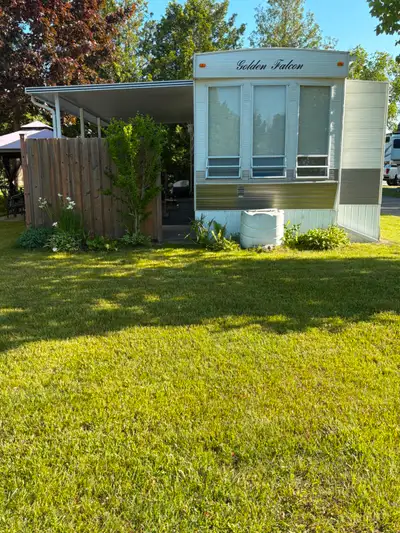 Woodland Park Family Campground is a beautifully landscaped park with access to a pool, hot tub, lau...