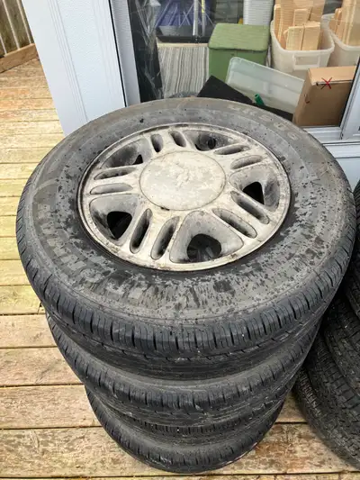Set of used tires with ($400) or without ($300) GM rims. All seasons 215/70R15.