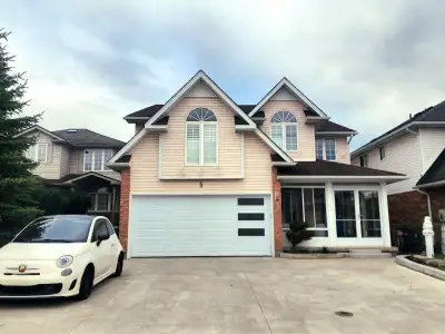 Bright and spacious second-floor bedroom available in a well-maintained executive home located in th...