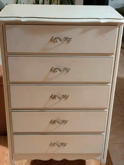 This is a used 5-drawer dresser, perfect for adding storage to any bedroom. Solid wood drawers and t...