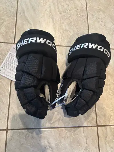 Selling a pair of brand new never used Sherwood Pro level hockey gloves. Senior size 13. See all ad...