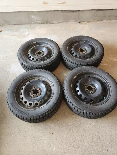 Selling a set of 4 Bridgestone Blizzak WS90 winter tires mounted and balanced on steel rims. Size: 2...