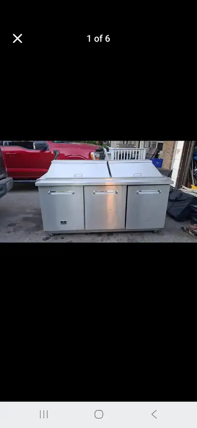 Great condition works well. Top surface is equipped with 2 chilled pivot door areas great for food p...