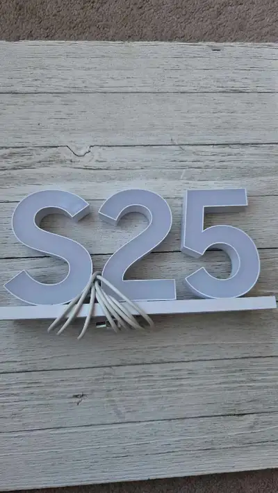 Samsung Galaxy S25 Commercial sign lights up., View more
