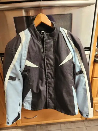 I'm selling a Natural Riders motorcycle jacket, perfect for any rider looking for protection and sty...