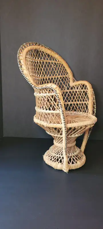 This vintage doll chair has a classic Peacock fan back style. Made of woven wicker rattan. In great...