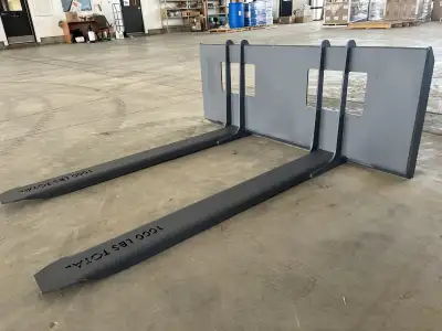 1,000Lb rated pallet forks for compact tractors with skid steer hookup. They weigh 120Lbs instead of...