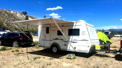 Selling our well-loved 18' hybrid trailer — sleeps up to 6 and tows light (GVWR 3,754 lb), so it's e...