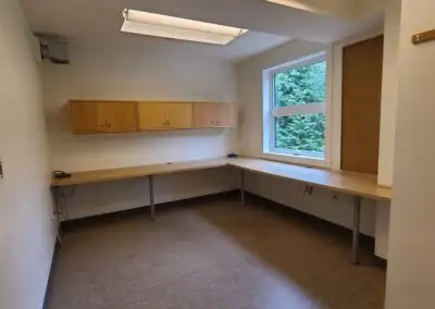 The office space, located at the back of Kitsilano Neighbourhood House, is a 156 sq ft workspace fea...