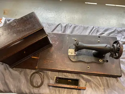 Original antique Singer treadle sewing machine restoration package. Removed carefully from a family-...
