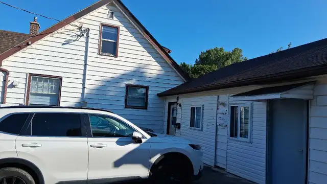 Office and parking lot for Used car dealership.