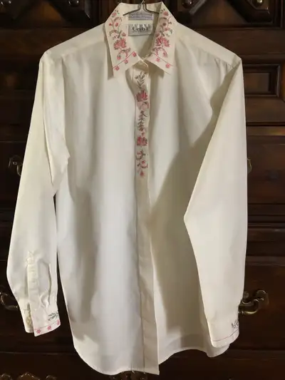 Skirt is linen/cotton blend, with two pockets. Size 10. Blouse is polyester/cotton blend. Size small...