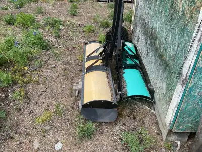 2 snow plows one complete with side extensions and one without, both 5 feet long