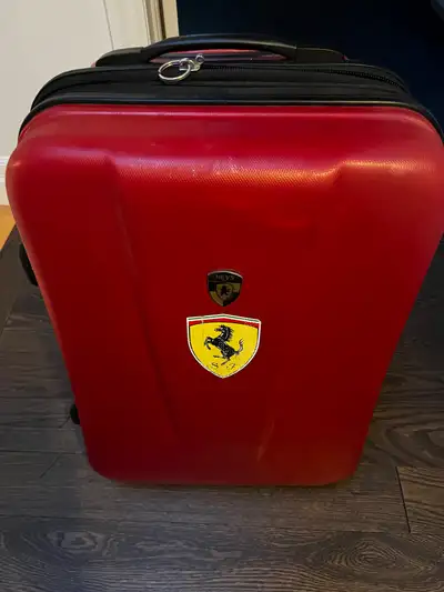 Heys check in luggage good condition Small scuff, zipper handle replaced Ferrari sticker easily remo...