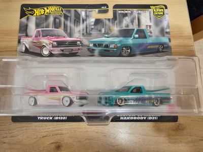 Brand new Hot Wheels Premium 2 pack. 1975 Datsun Sunny Truck { B120 } and Custom '93 Nissan Hardbody...