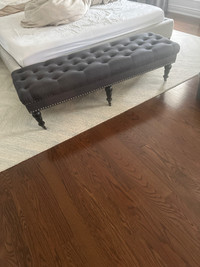 Grey tufted bench