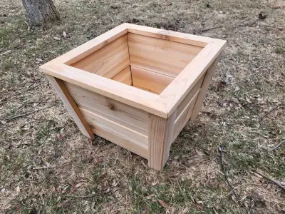Square cedar planter box. measures about 16 inches squared at the top and about a foot high. Ready f...