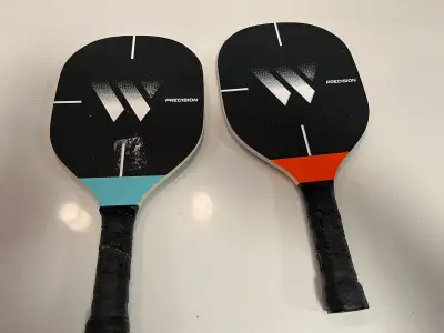 Up for grabs are these used Precision pickleball paddles, perfect for anyone looking to elevate thei...