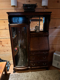 Antique cabinet with curved glass door
