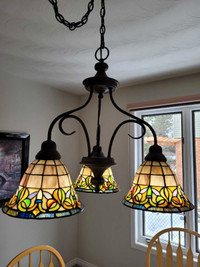 Light fixture, metal and stained glass. 