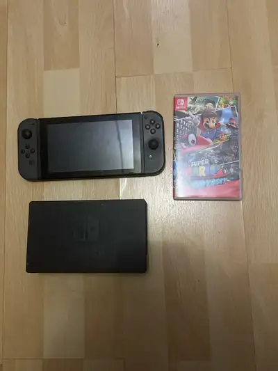 Nintendo Switch + Mario Odyssey, View more