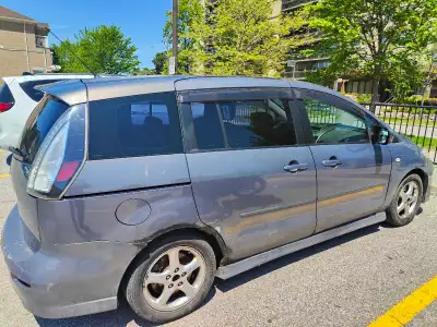 I am selling a 2009 Mazda 5, a versatile and reliable minivan that's perfect for families or anyone...