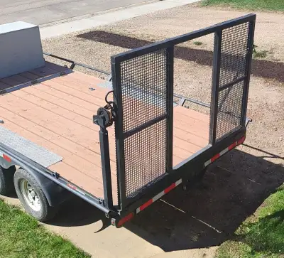 OBO. 14 ft heavy duty trailer, LIKE NEW BUT BUILT BETTER... with ramp/winch. 7000 lb (dual axle @ 35...