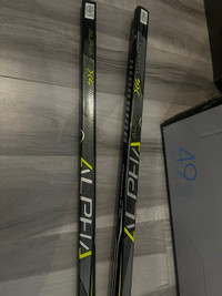 bâton de hockey alpha qx4